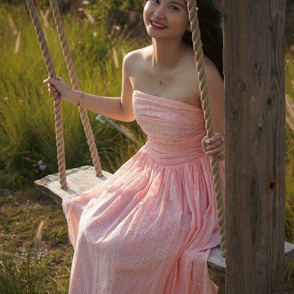 Person stretching outdoors during a beautiful sunset with yellow tones.